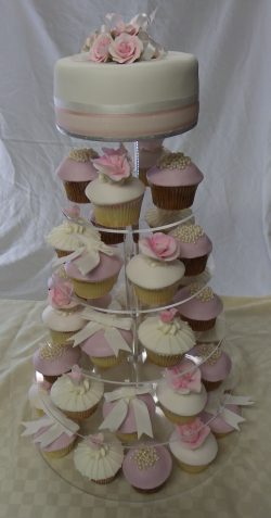 Pink rose, bows & pearls wedding cake