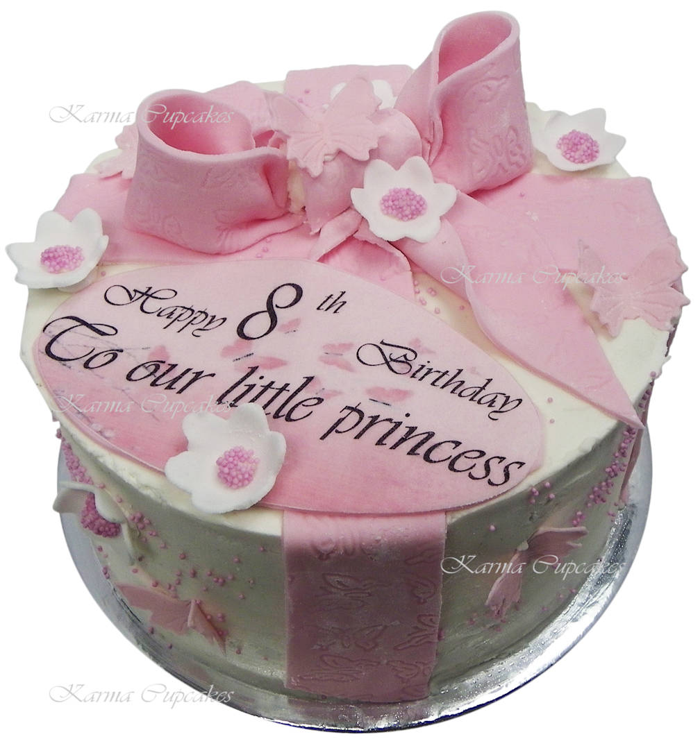 White and pink Birthday cake with edible bow and birthday sign copy