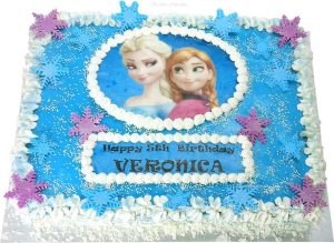 Frozen half slab buttercream iced cake with snow flakes
