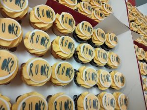 R U Ok? Round Logo on a Mini Vanilla/Chocolate Cupcake - Minimum 24