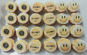 R U OK ?, smiley face and ? Round Logo on a Mini Vanilla/Chocolate Cupcake