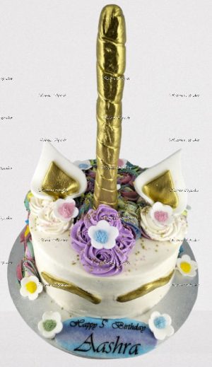 Unicorn cake with sugar flowers and edible greeting